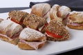 Sandwiches cutted into peaces with different breads and fillings