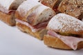 Sandwiches cutted into peaces with different breads and fillings