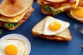 Sandwiches with egg, ham and toast cheese fried in a pan, generative ai, tasty breakfast