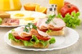 Sandwiches with eggs on plate for breakfast on linen tablecloth Royalty Free Stock Photo
