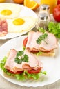Sandwiches with eggs on plate for breakfast on linen tablecloth Royalty Free Stock Photo