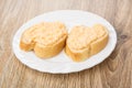 Sandwiches with fish sauce in white plate on table