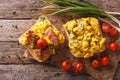 sandwiches with fried eggs, bacon and tomatoes close-up horizontal top view Royalty Free Stock Photo