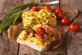 Sandwiches with fried eggs, bacon and tomatoes close-up on the t Royalty Free Stock Photo