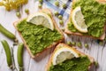 Sandwiches with green peas close up. horizontal top view Royalty Free Stock Photo