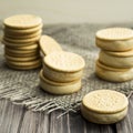 Sandwiches made from cookies and ice cream with condensed milk on a table with burlap Royalty Free Stock Photo