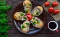 Sandwiches with mushrooms, turkey liver and tartar sauce on crispy baguette and a cup of coffee.