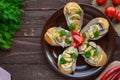 Sandwiches with mushrooms, turkey liver and tartar sauce on crispy baguette.