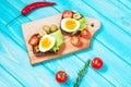 Sandwiches with olive, quail eggs, cherry tomatoes and potatoes Royalty Free Stock Photo