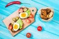 Sandwiches with olive, quail eggs, cherry tomatoes and potatoes Royalty Free Stock Photo