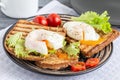 Sandwiches with poached egg on rye bread. Royalty Free Stock Photo