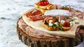 Sandwiches with prosciutto, fresh figs, dorblyu and berries with ingredients on rustic stump, top view Royalty Free Stock Photo