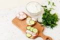 Sandwiches with radish and sour cream sauce