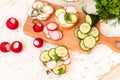 Sandwiches with radish and sour cream sauce and vegetables