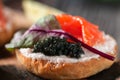 Sandwiches with red, black caviar and trout Royalty Free Stock Photo