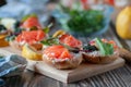 Sandwiches with red, black caviar and trout