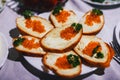 Sandwiches with red caviar fish and butter and parsley
