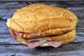 Sandwiches of roast beef slices and Salami in a long bun bread with lettuce and mayonnaise, roasted slices of beef meat as a Royalty Free Stock Photo