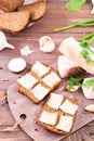 Sandwiches from rye bread and salted bacon on a cutting board Royalty Free Stock Photo