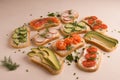 Sandwiches with salmon, cucumber, tomatoes, avocados and greens, vegetable sliced