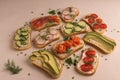 Sandwiches with salmon, cucumber, tomatoes, avocados and greens, vegetable sliced