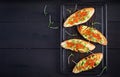 Sandwiches with salmon red caviar and salsa with avocado. Royalty Free Stock Photo