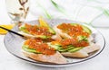 Sandwiches with salmon red caviar with sliced avocado. Royalty Free Stock Photo