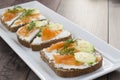 Sandwiches with salmon, ricotta, dill and cucumber. Royalty Free Stock Photo