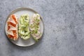 Sandwiches with vegetables, radishes, tomatoes, cucumbers and microgreens on gray. View from above Royalty Free Stock Photo