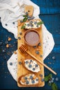 Sandwiches with soft cheese and blueberries on a wooden background. A healthy breakfast Royalty Free Stock Photo