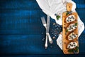 Sandwiches with soft cheese and blueberries on a wooden background. A healthy breakfast Royalty Free Stock Photo