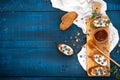 Sandwiches with soft cheese and blueberries on a wooden background. A healthy breakfast Royalty Free Stock Photo