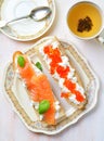 Sandwiches with soft cheese and smoked salmon caviar Royalty Free Stock Photo