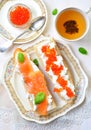 Sandwiches with soft cheese and smoked salmon caviar Royalty Free Stock Photo