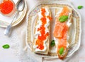 Sandwiches with soft cheese and smoked salmon caviar Royalty Free Stock Photo