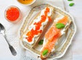 Sandwiches with soft cheese and smoked salmon caviar Royalty Free Stock Photo