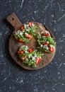 Sandwiches with strawberries, arugula and blue cheese. Delicious snack, breakfast or a snack with wine. Royalty Free Stock Photo