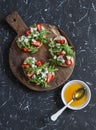 Sandwiches with strawberries, arugula and blue cheese. Delicious snack, breakfast or a snack with wine. Royalty Free Stock Photo