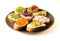 Sandwiches or tapas prepared with bread and tasty ingredients. Could be nice food for healthy breakfast ot lunch. Copy space for Royalty Free Stock Photo