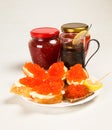 Sandwiches and tartlet with red salmon caviar, lemon slice on a plate. Royalty Free Stock Photo