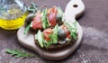 Sandwiches with trout, capers and arugula