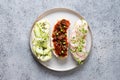 Sandwiches with vegetables, radishes, tomatoes, cucumbers and microgreens on gray. View from above Royalty Free Stock Photo