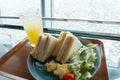 Sandwishes, salad and pineapple juice breakfast Royalty Free Stock Photo