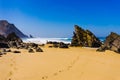 Sandy Adraga beach between rocks coastline of Atlantic ocean Royalty Free Stock Photo