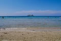 Sandy Barcaggio beach with clear turquoise water and view of Ile de la Giraglia. Corsica, France. Royalty Free Stock Photo