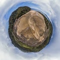 Sandy beach aerial tiny planet with hill and trees