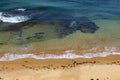 Sandy beach and azure blue clear sea