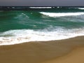 Stormy sea with dark green water and white waves