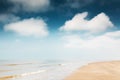 Sandy beach and blue sky with clouds. Royalty Free Stock Photo