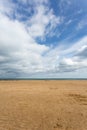 Sandy beach with blue sky at low tide at Benllech Royalty Free Stock Photo